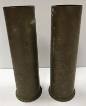 Two World War II trench art brass shell case vases, each decorated with incised foliate sprays,