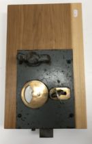 A Charles Smith & Sons of Birmingham iron and brass safe door lock with key