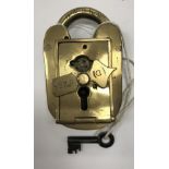 A vintage brass padlock by Tucker & Reeve, No'd.