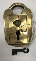 A vintage brass padlock by Tucker & Reeve, No'd.