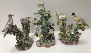 A pair of circa 1765-1770 Bow porcelain candlesticks as birds amongst flower set branches with