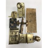 A collection of five various door locks and keys including a brass Strongs Patent example,
