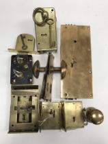 A collection of five various door locks and keys including a brass Strongs Patent example,