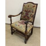 A walnut framed hall chair in the 17th Century Flemish taste with upholstered back and seat flanked