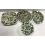 A collection of 19th Century Chinese celadon glazed famille rose dinner wares decorated with