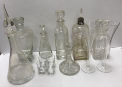 A collection of seven decanters, including one glug glug decanter,