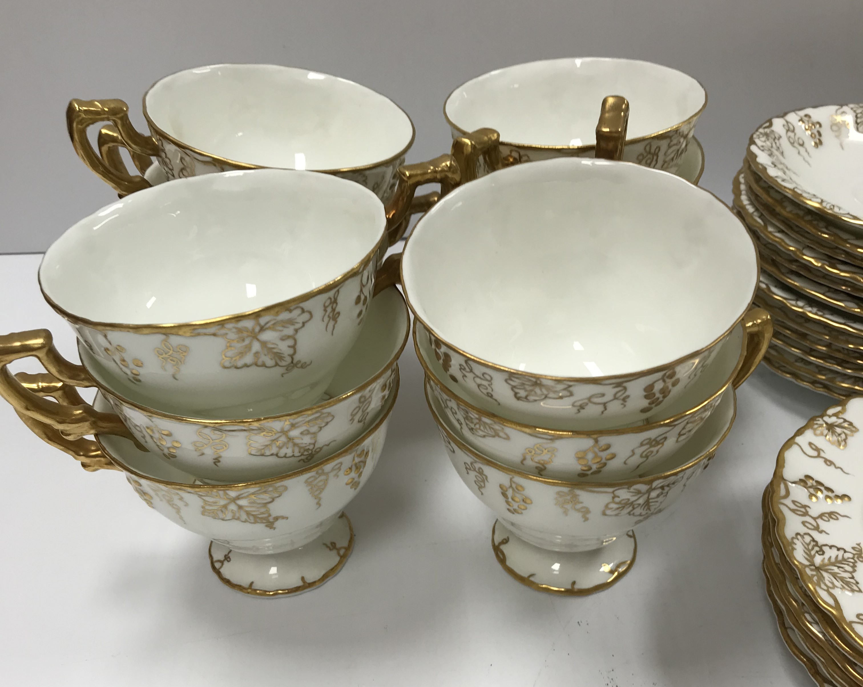 A Royal Crown Derby "Vine" pattern white glazed and gilt decorated tea set, - Image 2 of 5