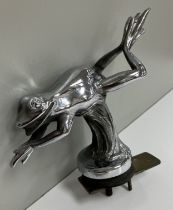 An early 20th Century French chrome plated car mascot as a driving frog,