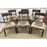 A set of six Regency mahogany bar back dining chairs with upholstered seats on square reeded