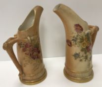 A pair of Royal Worcester blush ware tusk jugs, each decorated with floral sprays,