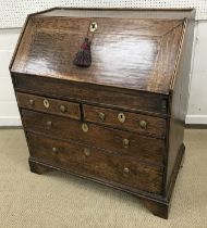 An early 18th Century oak bureau,