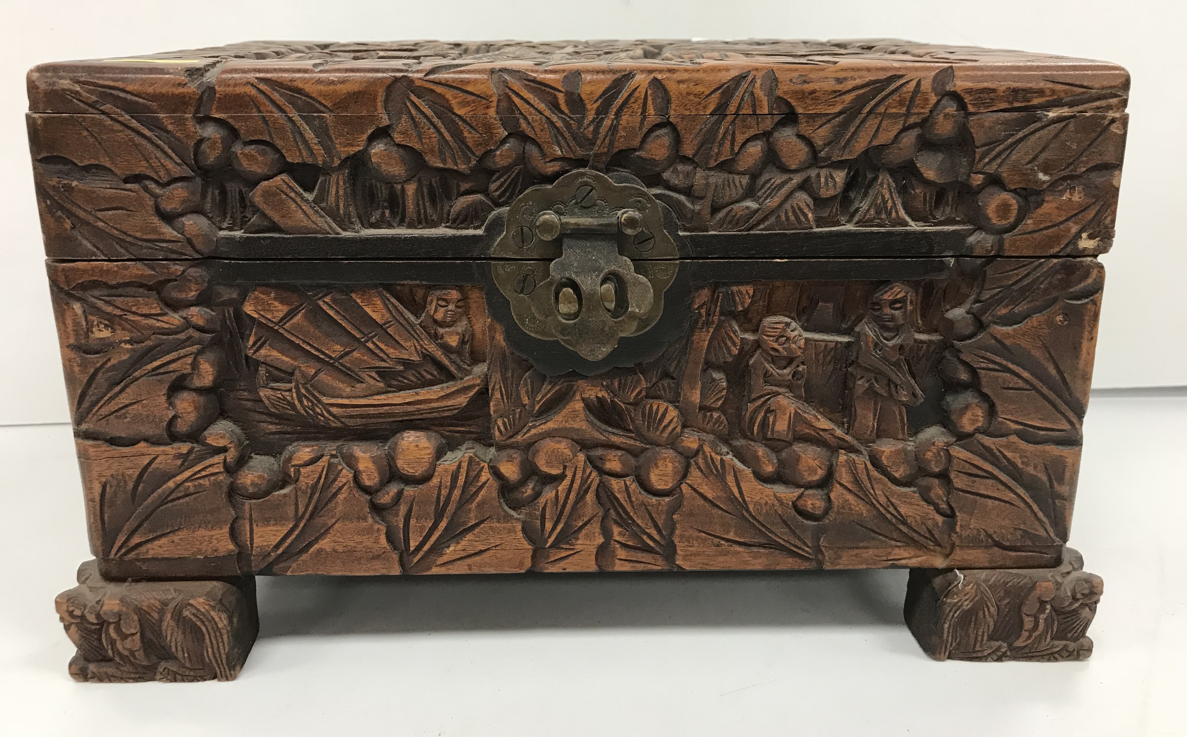 An Indonesian carved camphor wood miniature trunk with all over figural and foliate decoration - Image 4 of 8