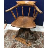 A late Victorian yoke back swivel office chair on sleigh type base 85.