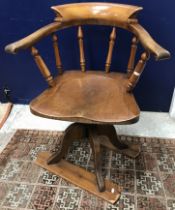 A late Victorian yoke back swivel office chair on sleigh type base 85.
