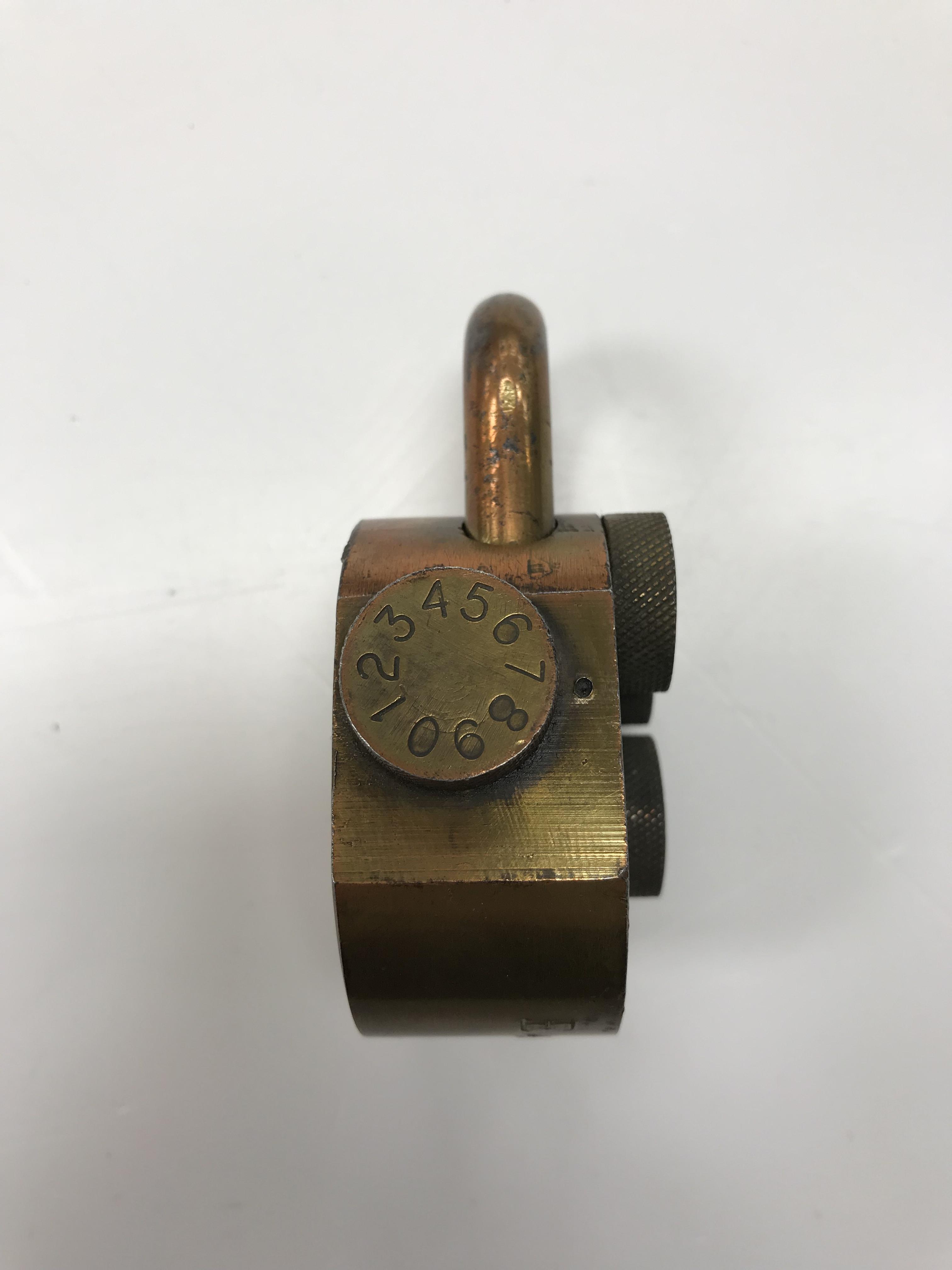 A vintage Sesame quadruple barrel combination lock in brass, 6 cm diameter, 8. - Image 2 of 3
