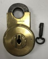 A Cotterills patent climax detector brass padlock and key (lock cover missing)