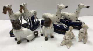 A pair of late 19th Century Staffordshire pottery figures of seated dalmatians as inkwells 18.