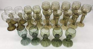 A set of three German green glass roemers, approx 13 cm high, together with another similar darker,