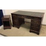 A reproduction mahogany double pedestal kneehole desk with tooled and gilded leather three section