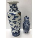 A Chinese blue and white vase, the main body decorated with five toed dragons amongst clouds,