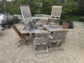 A teak D end slatted garden table 191 x 72 x 72 cm high with eight chairs