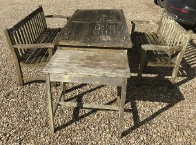 A slatted teak garden table of rectangular form, 180 cm wide x 90 cm deep x 76 cm high,