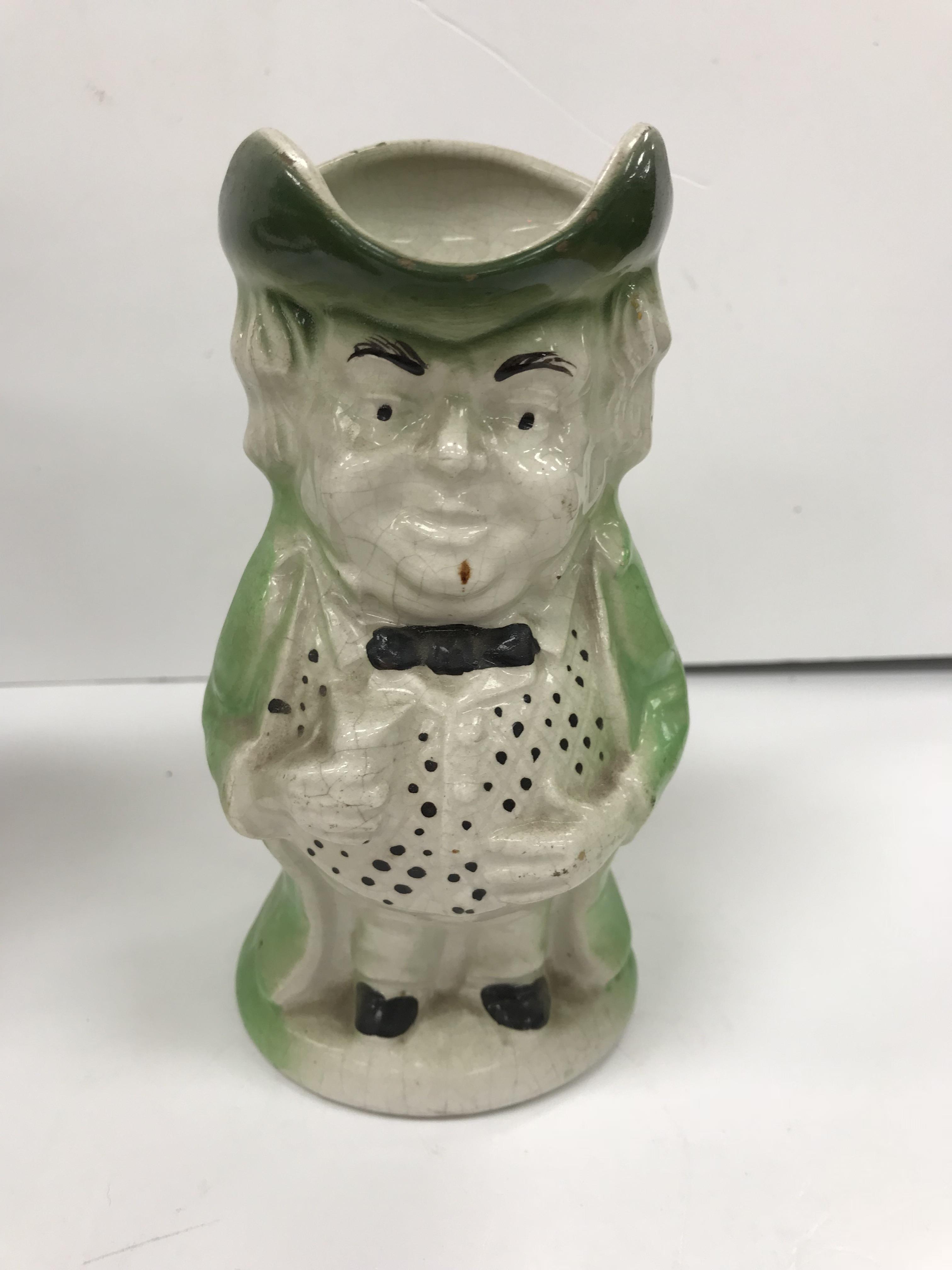 A 19th Century polychrome decorated Staffordshire figure of a "Squire Toby" as a jug, - Image 4 of 4