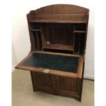 A late Victorian oak student's bureau, the three quarter galleried top over a fall front,