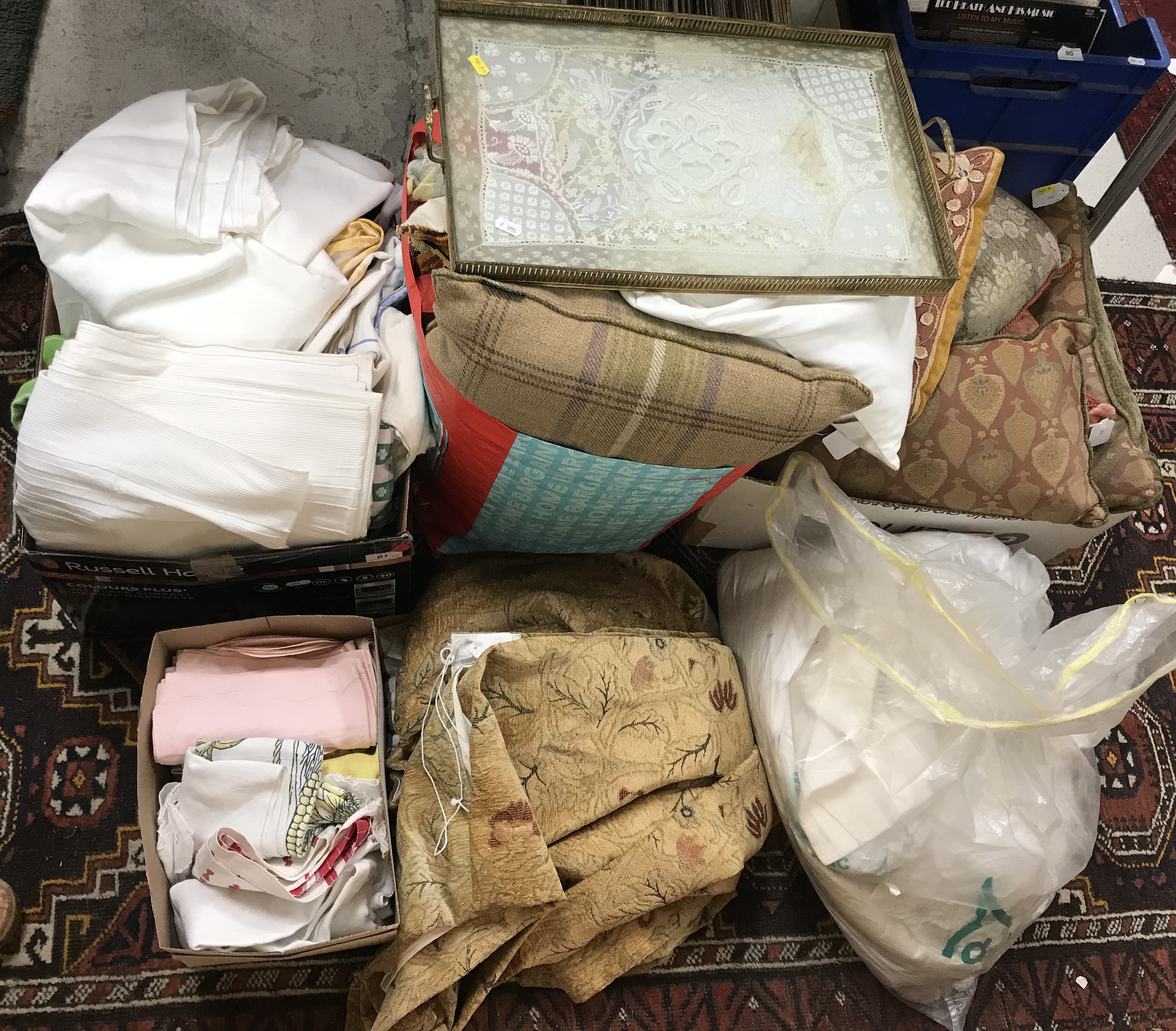 A box containing various household table linens etc to include cotton tablecloths,