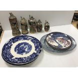 A collection of various serving plates/platters and a collection of Germany steins,