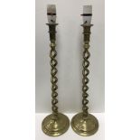 A pair of brass open barley twist altar type candlesticks with applied removable bayonet fixings 52.