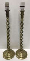 A pair of brass open barley twist altar type candlesticks with applied removable bayonet fixings 52.
