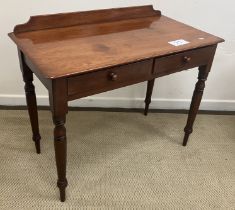 A Victorian mahogany two drawer side table on turned tapering legs 98 cm wide x 51 cm deep x 78 cm