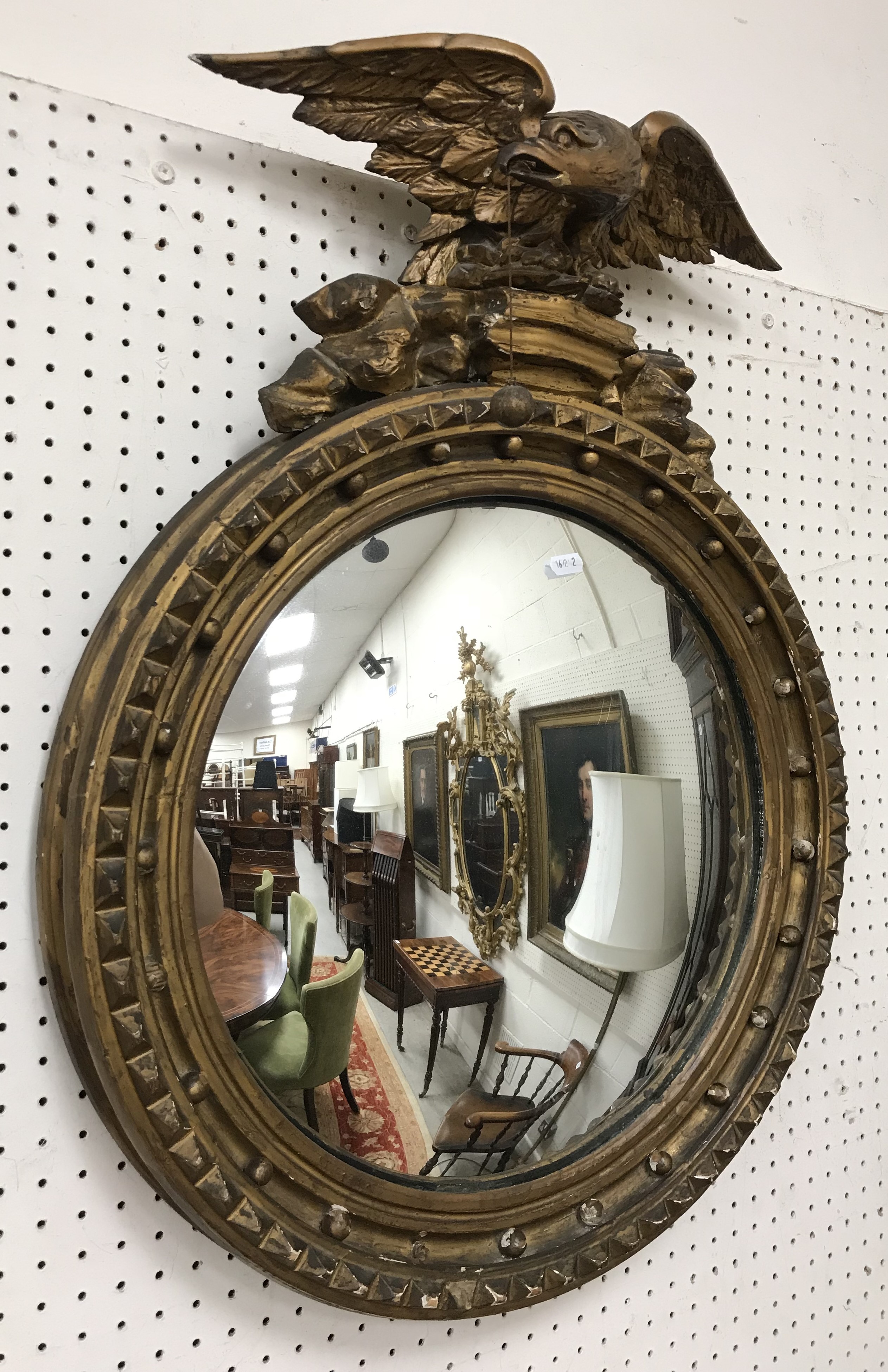 A 19th Century carved giltwood and gesso framed circular wall mirror,