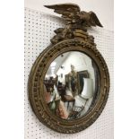 A 19th Century carved giltwood and gesso framed circular wall mirror,