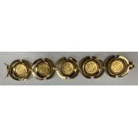 An 18 carat gold bracelet with Arezzo hallmarks, set with five George V gold half sovereigns, 1913,