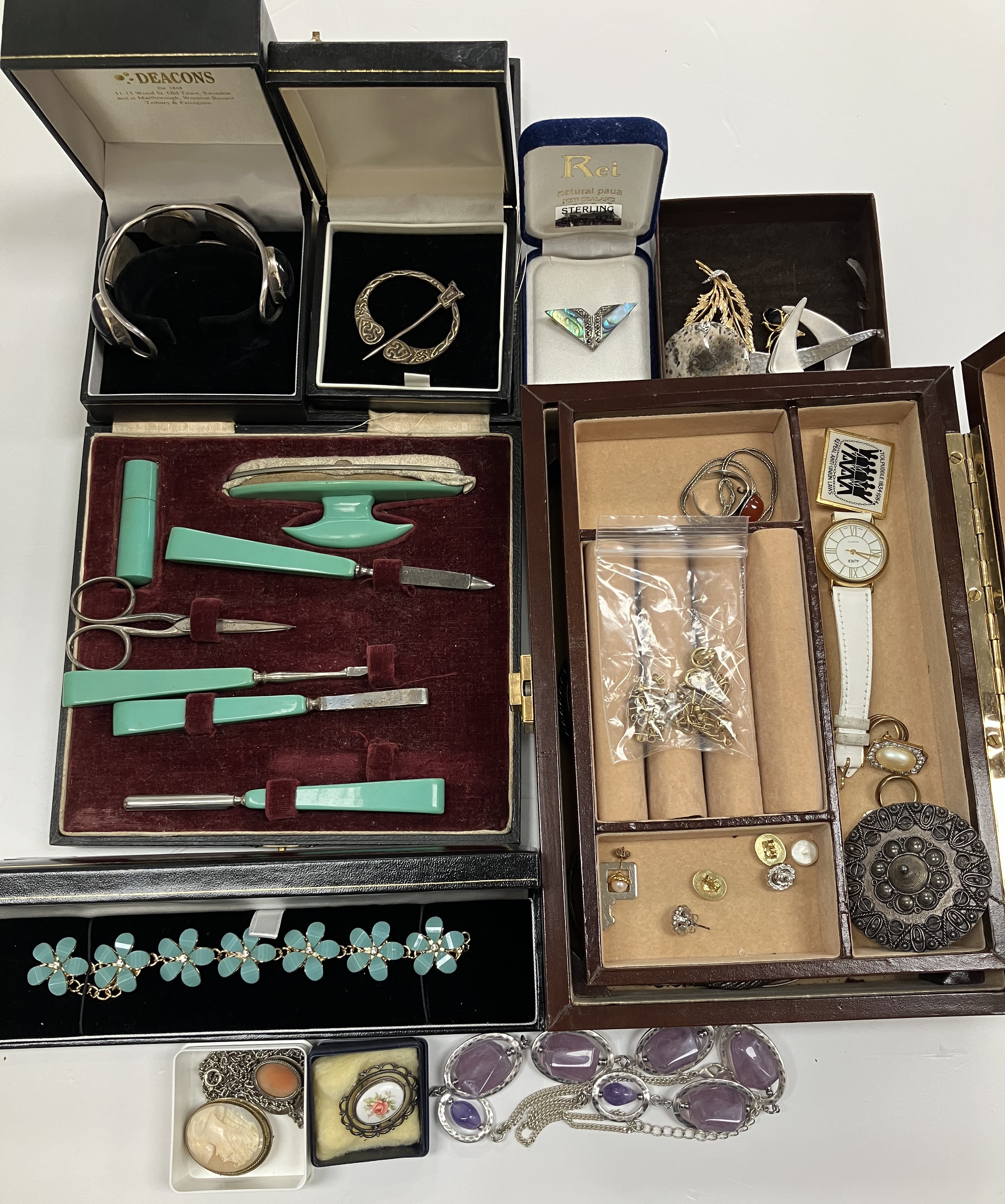 A collection of costume jewellery to include various mid 20th Century and later brooches,