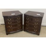 A pair of reproduction mahogany bow fronted dwarf bachelor chests,