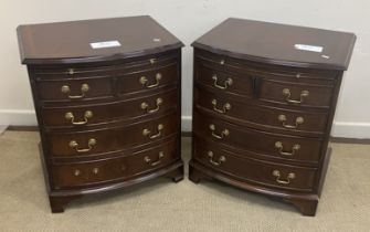 A pair of reproduction mahogany bow fronted dwarf bachelor chests,
