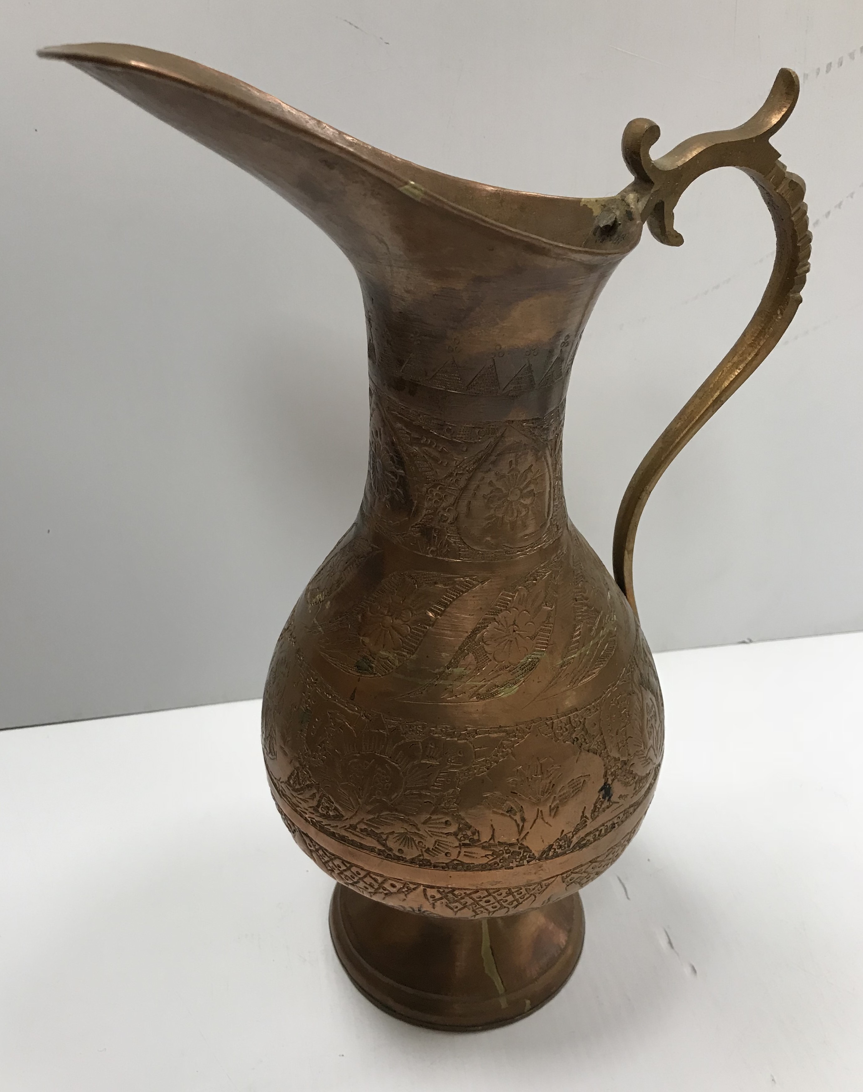 A Middle Eastern silvered coffee pot with engraved decoration, 34. - Image 2 of 5