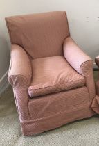 A circa 1900 upholstered scroll arm chair on bun feet to castors,