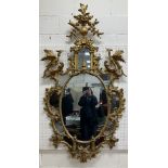 An 18th Century carved giltwood and gesso framed wall mirror in the Chinese Chippendale taste,