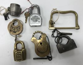 A collection of 7 various unusual padlocks including a John Bull Patent brass padlock by A.A.L. Co.
