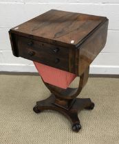 A William IV rosewood sewing table, the rounded rectangular drop-leaf top,