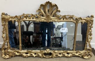 An 18th Century French carved giltwood and gesso framed over mantel mirror with pierced foliate