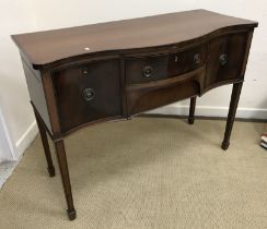 An Edwardian mahogany serpentine fronted sideboard,