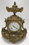 A 19th Century French gilt brass cased mantel clock,