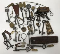 A collection of 24 various keys, mostly with brass and other tags, including “Guard House”,