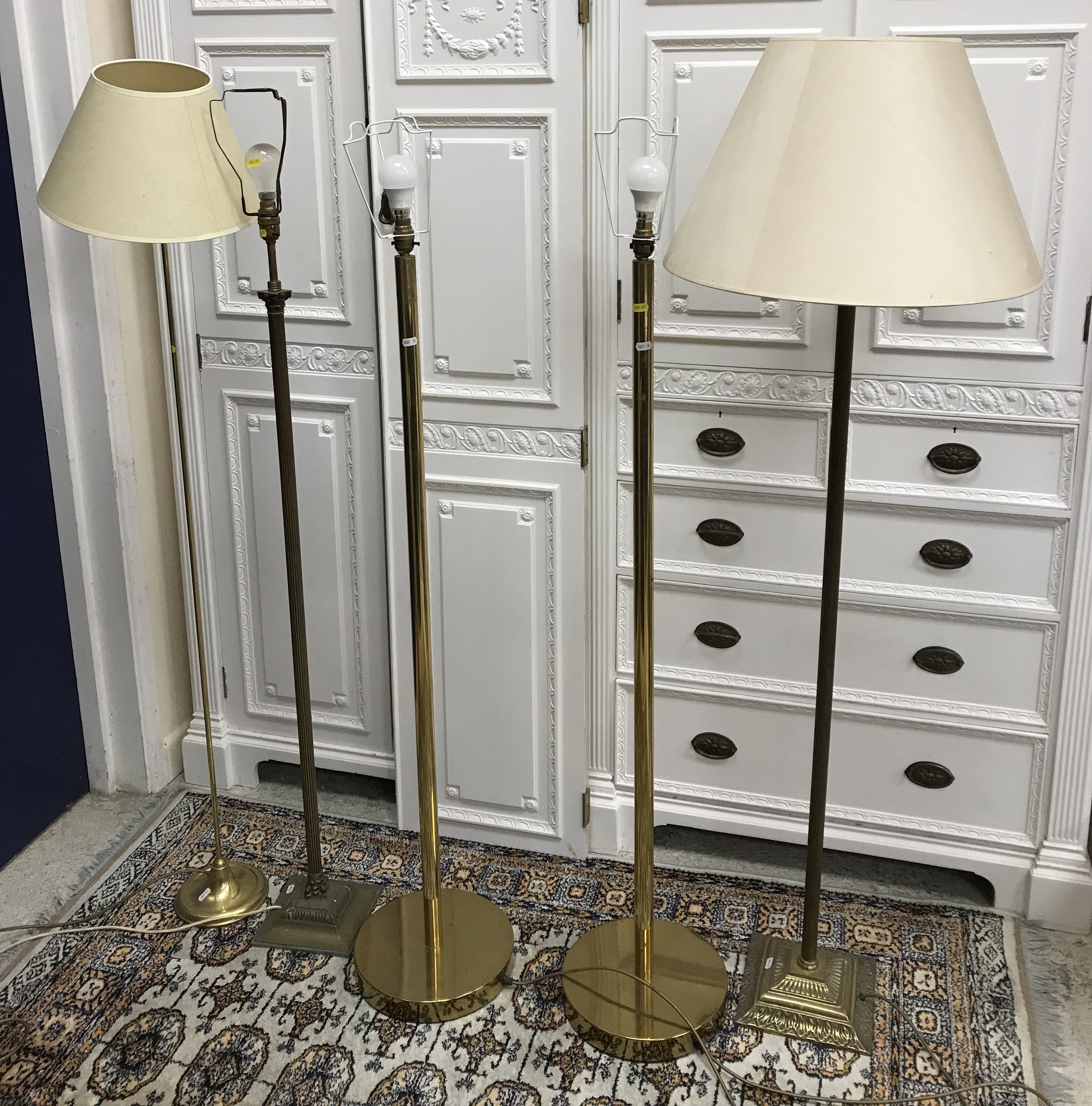 A pair of modern brass standard lamps,