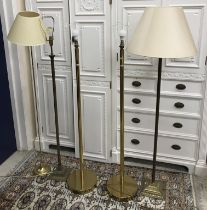 A pair of modern brass standard lamps,